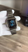 HIGH END watch with dark blue dial and silver band.